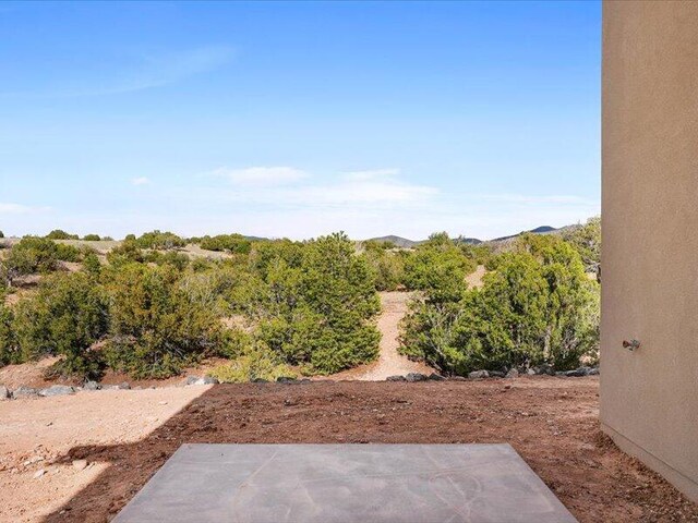 19 Anasazi Trl, Sandia Park, NM 87047 - view of yard featuring a patio area
