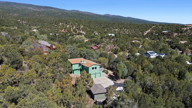 bird's eye view with a wooded view and a mountain view