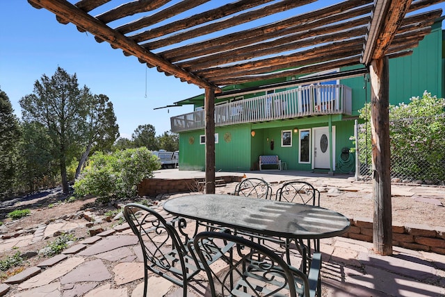 view of patio / terrace with outdoor dining space and a balcony