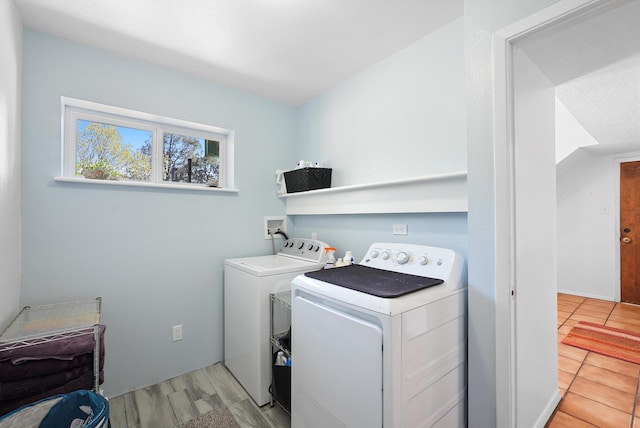 laundry area with laundry area and separate washer and dryer