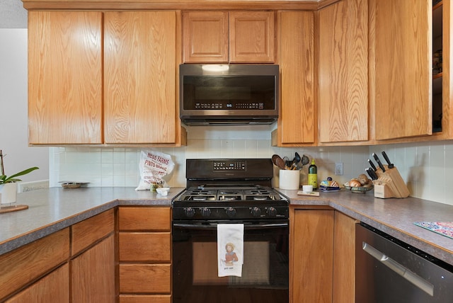 kitchen with decorative backsplash and stainless steel appliances