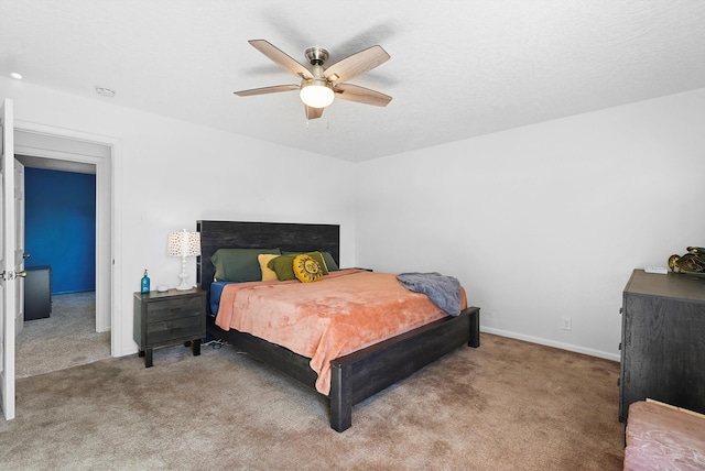 bedroom with carpet flooring, ceiling fan, and baseboards