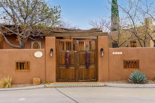 view of gate featuring fence