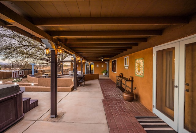 view of patio featuring ceiling fan and french doors