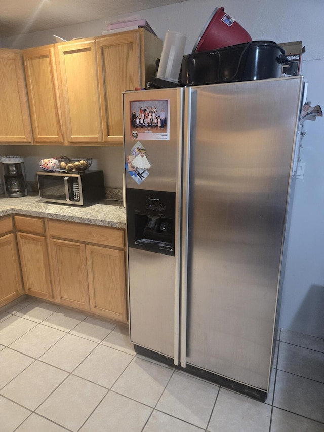 908 W Chavez Ave, Belen, NM 87002 - kitchen featuring appliances with stainless steel finishes and light tile patterned flooring