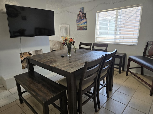 908 W Chavez Ave, Belen, NM 87002 - dining area with light tile patterned flooring