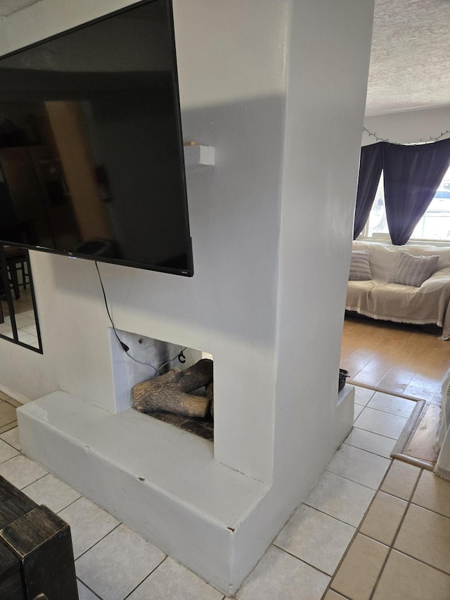 908 W Chavez Ave, Belen, NM 87002 - staircase featuring a textured ceiling and tile patterned floors