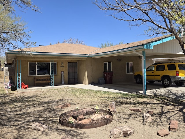 908 W Chavez Ave, Belen, NM 87002 - exterior space with stucco siding and an attached carport