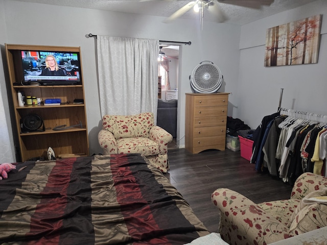 908 W Chavez Ave, Belen, NM 87002 - bedroom with a textured ceiling, ceiling fan, and wood finished floors