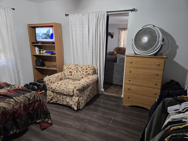 908 W Chavez Ave, Belen, NM 87002 - bedroom featuring dark wood finished floors