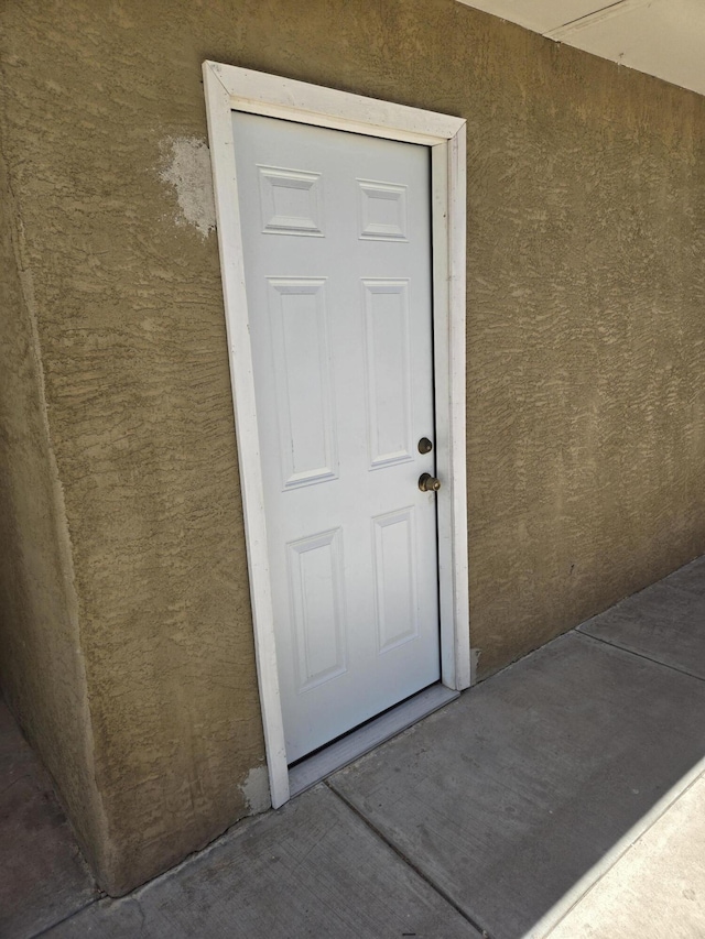 908 W Chavez Ave, Belen, NM 87002 - view of exterior entry with stucco siding