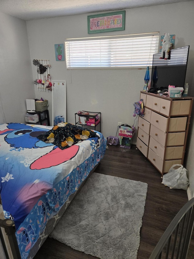 908 W Chavez Ave, Belen, NM 87002 - bedroom featuring wood finished floors