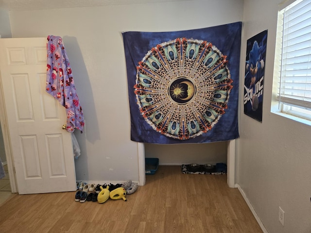 908 W Chavez Ave, Belen, NM 87002 - room details with baseboards and wood finished floors