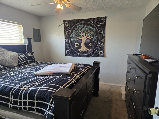 908 W Chavez Ave, Belen, NM 87002 - bedroom featuring carpet flooring, a textured ceiling, a ceiling fan, baseboards, and electric panel