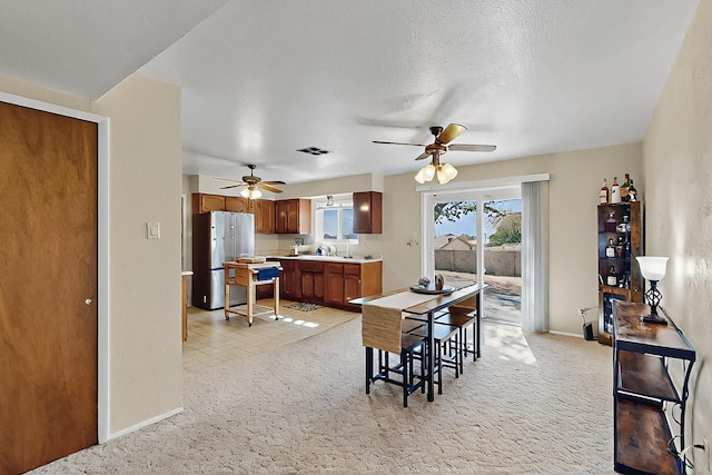 1513 Muriel St NE, Albuquerque, NM 87112 - dining area with a ceiling fan and light carpet
