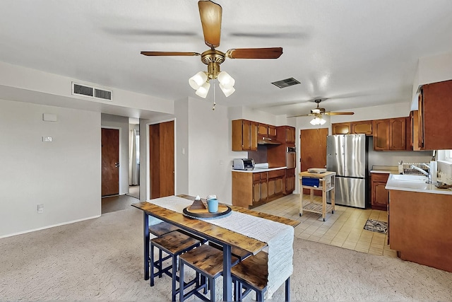 1513 Muriel St NE, Albuquerque, NM 87112 - dining area featuring a ceiling fan and light colored carpet