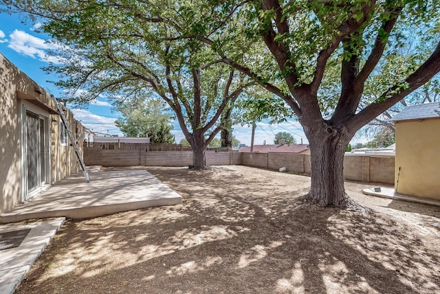 1513 Muriel St NE, Albuquerque, NM 87112 - fenced backyard with a patio area