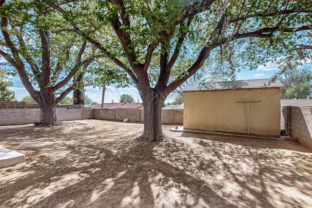1513 Muriel St NE, Albuquerque, NM 87112 - fenced backyard with an outdoor structure
