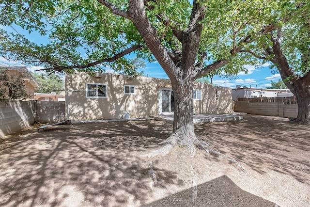 1513 Muriel St NE, Albuquerque, NM 87112 - fenced backyard featuring a patio area