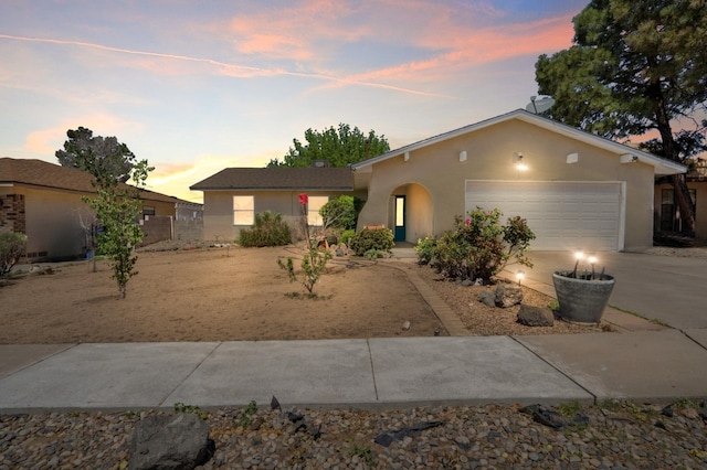 7225 Ticonderoga Rd NE, Albuquerque, NM 87109 - single story home featuring stucco siding, a garage, and concrete driveway