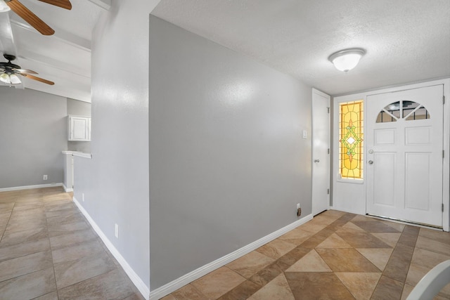 7225 Ticonderoga Rd NE, Albuquerque, NM 87109 - entryway with a textured ceiling, ceiling fan, and baseboards