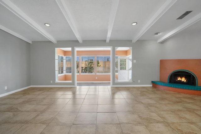 7225 Ticonderoga Rd NE, Albuquerque, NM 87109 - unfurnished living room featuring beamed ceiling, baseboards, a warm lit fireplace, and light tile patterned floors