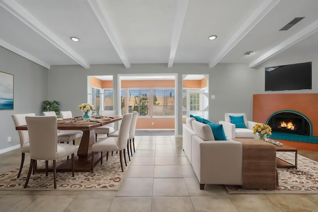 7225 Ticonderoga Rd NE, Albuquerque, NM 87109 - living area with beam ceiling, baseboards, a warm lit fireplace, and light tile patterned floors