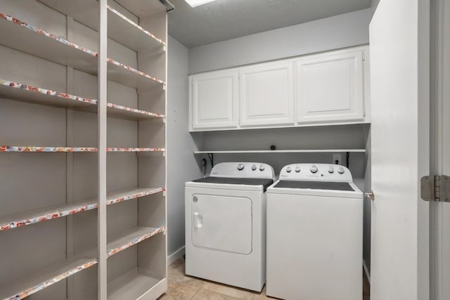 7225 Ticonderoga Rd NE, Albuquerque, NM 87109 - laundry room featuring cabinet space and washing machine and clothes dryer