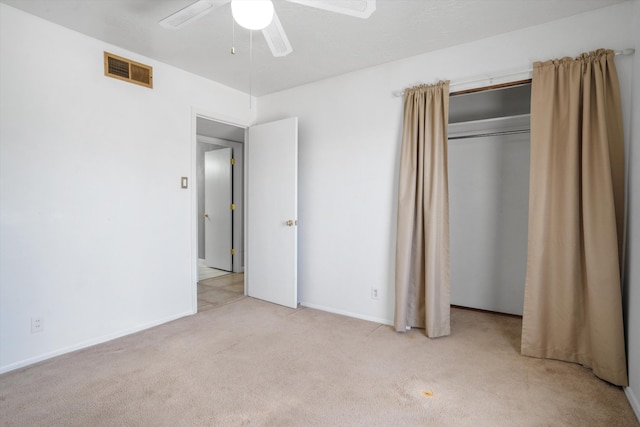 7225 Ticonderoga Rd NE, Albuquerque, NM 87109 - unfurnished bedroom with visible vents, a ceiling fan, a closet, baseboards, and carpet flooring
