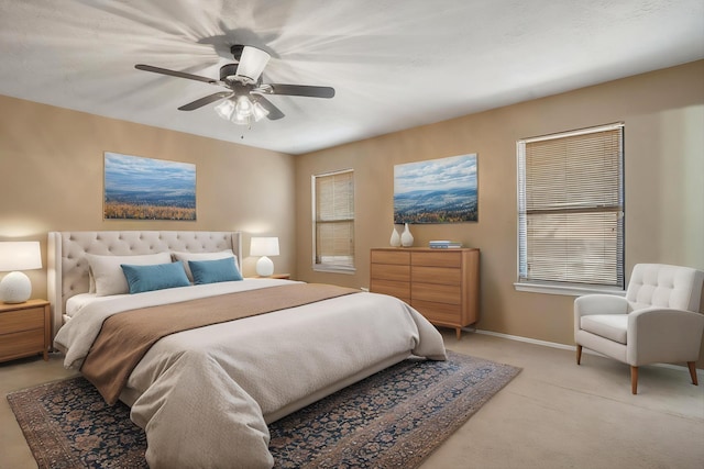 7225 Ticonderoga Rd NE, Albuquerque, NM 87109 - bedroom with ceiling fan, light colored carpet, and baseboards