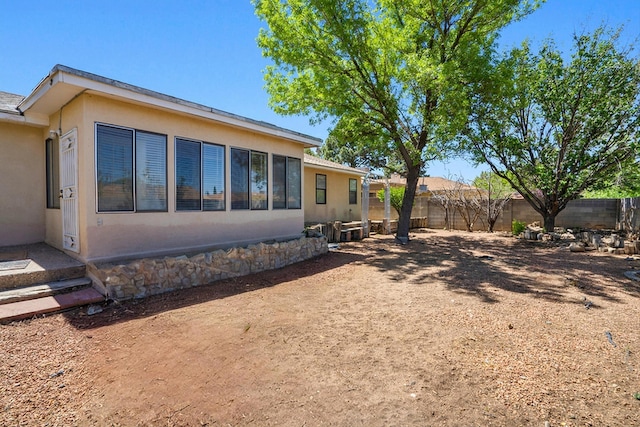 7225 Ticonderoga Rd NE, Albuquerque, NM 87109 - exterior space with a fenced backyard and stucco siding