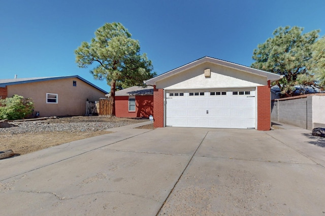 6625 Barnhart St NE, Albuquerque, NM 87109 - view of front facade with brick siding, fence, and driveway