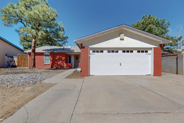 6625 Barnhart St NE, Albuquerque, NM 87109 - single story home featuring brick siding, an attached garage, fence, and concrete driveway