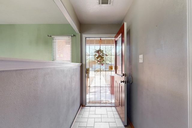 6625 Barnhart St NE, Albuquerque, NM 87109 - doorway to outside with baseboards, plenty of natural light, and visible vents
