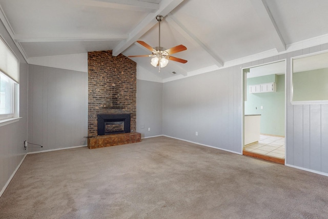 6625 Barnhart St NE, Albuquerque, NM 87109 - unfurnished living room with a brick fireplace, ceiling fan, carpet flooring, and vaulted ceiling with beams
