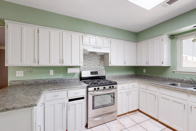6625 Barnhart St NE, Albuquerque, NM 87109 - kitchen featuring a sink, stainless steel range with gas stovetop, white cabinets, and under cabinet range hood
