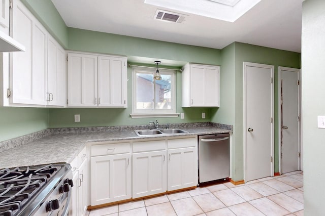 6625 Barnhart St NE, Albuquerque, NM 87109 - kitchen featuring white cabinets, light tile patterned flooring, a sink, stainless steel appliances, and visible vents