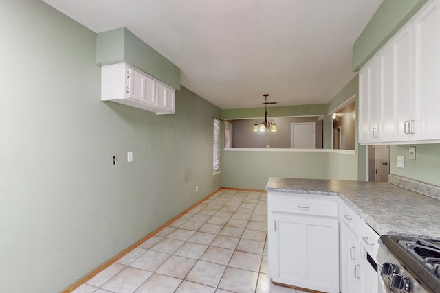 6625 Barnhart St NE, Albuquerque, NM 87109 - kitchen with pendant lighting, light tile patterned floors, a peninsula, a chandelier, and white cabinetry