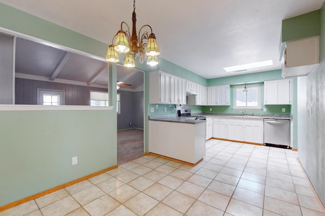 6625 Barnhart St NE, Albuquerque, NM 87109 - kitchen featuring plenty of natural light, white cabinetry, appliances with stainless steel finishes, and light tile patterned flooring