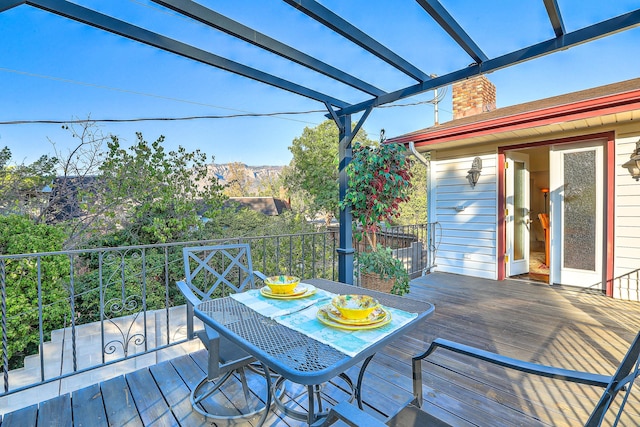 4719 Huntington Dr NE, Albuquerque, NM 87111 - wooden terrace with a pergola and outdoor dining space