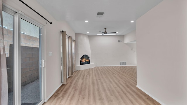 11119 Sidney Ave NE, Albuquerque, NM 87111 - interior space with baseboards, a fireplace, a ceiling fan, and light wood finished floors