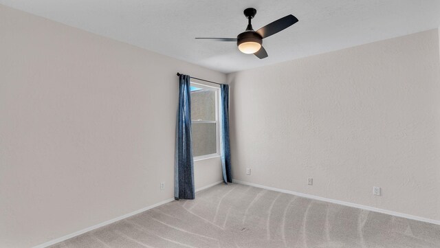 11119 Sidney Ave NE, Albuquerque, NM 87111 - spare room featuring light colored carpet, a ceiling fan, and baseboards