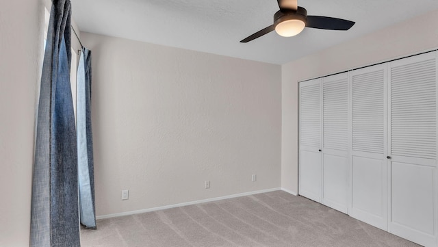 11119 Sidney Ave NE, Albuquerque, NM 87111 - unfurnished bedroom featuring baseboards, a closet, light carpet, and ceiling fan
