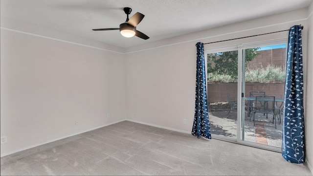 11119 Sidney Ave NE, Albuquerque, NM 87111 - spare room with carpet floors, baseboards, and a ceiling fan