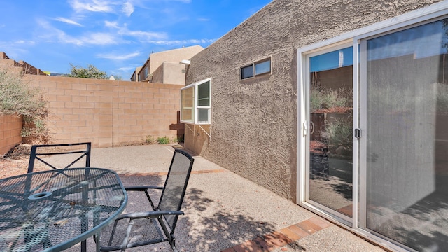 11119 Sidney Ave NE, Albuquerque, NM 87111 - view of patio / terrace with fence and outdoor dining area