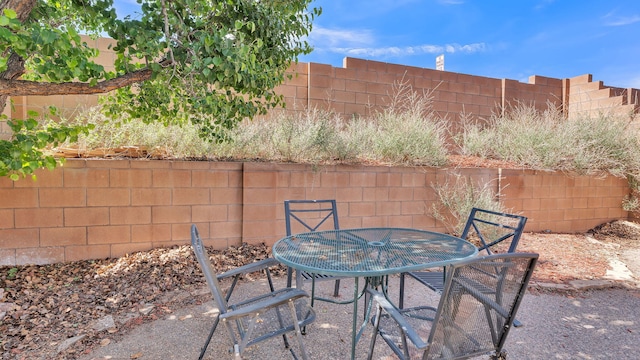 11119 Sidney Ave NE, Albuquerque, NM 87111 - view of patio featuring a fenced backyard and outdoor dining space