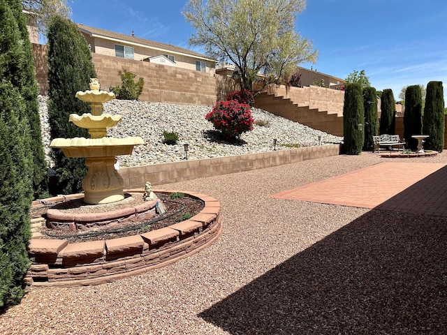 view of yard featuring a patio and fence