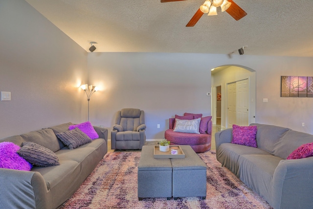 5679 Cold Creek Ave NW, Albuquerque, NM 87114 - living area with track lighting, arched walkways, ceiling fan, and a textured ceiling