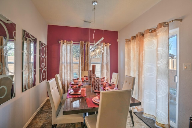 5679 Cold Creek Ave NW, Albuquerque, NM 87114 - dining room with stone finish flooring, visible vents, and plenty of natural light
