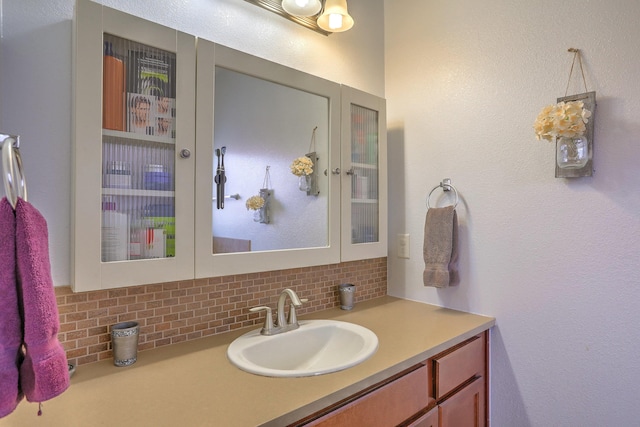 5679 Cold Creek Ave NW, Albuquerque, NM 87114 - bathroom featuring vanity and tasteful backsplash